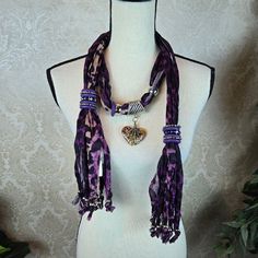 Size: 66" L Including Fringed Ends Color: Purple, Black, Cream Style: Scarf Necklace/Jewelry Materials: 100% Polyester Condition: Nwt, No Signs Of Wear Or Damage Purple Animal Print Scarf With Fringe And Beads At Both Ends. Stone Heart Is Wrapped In Silver. Silver Bead Accents Along With Adjustable Rings. This Piece Can Be Worn In A Variety Of Ways - Some Possibilities Are Shown. A Great Gift For Yourself Or A Loved One. H0673 Animal Print Silver Jewelry Necklace Oblong Scarf Gift Gifts Birthday Purple Animal Print, Purple Animals, Jewelry Materials, Scarf With Fringe, Style Scarf, Animal Print Scarf, Scarf Necklace, Silver Jewelry Necklace, Cream Style