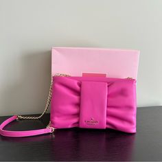 Selling A Cute New With Tags And Box Kate Spade Hot Pink Leather Bow Bag. This Is An Adorable Cross Body Bag Style Name Is Millie And The Color Is Magenta Lipstick Pink. The Chain Is Gold And Has A Leather Strap At The Top For Comfort. The Bag Is Brand New With Tags And Will Come With The Box Hot Pink Crossbody Bag, Pink Rectangular Leather Clutch, Luxury Pink Leather Clutch, Kate Spade Pink Bags For Evening, Pink Leather Clutch With Removable Pouch, Pink Kate Spade Bag For Evening, Pink Kate Spade Evening Bag, Pink Evening Clutch With Detachable Strap, Evening Pink Clutch With Detachable Strap