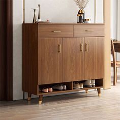 a wooden cabinet with shoes and purses on top