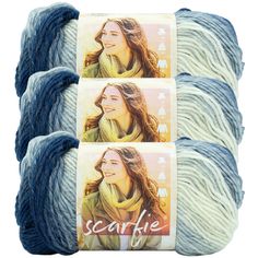 four skeins of blue and white yarn, each with a woman's face