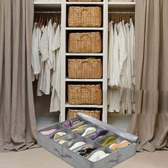 an organized closet with shoes and linens in the bottom drawer, next to curtains