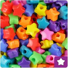 a pile of brightly colored plastic star shaped beads