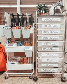 two metal shelving units with labels on them and some other items in the bins