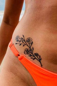 a woman's stomach with flowers on it