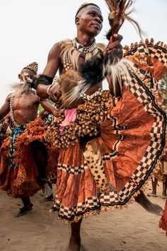 an african man is dancing with other people