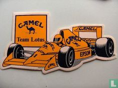 an orange and black sticker depicting a racing car with the name camel team lotus on it