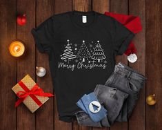 Merry Christmas Tree Shirt,Matching Christmas Sweatshirt,Christmas Gift for Women,Christmas Group Tee,Holiday Shirt,Christmas Crewneck Shirt Merry Christmas Shirt,Christmas Sweatshirt,Christmas Gift,Family Christmas Shirt,Christmas Group Tee,Holiday Shirt,Christmas Shirt for Women,Merry Christmas Sweatshirt, Christmas Shirts, Cute Winter Sweater, Christmas Shirt for Women, Christmas Crewneck Sweatshirt, Holiday Sweater,Christmas T shirt, Christmas Family Shirt,Christmas Gift, Merry Christmas Shirt,Christmas Family Shirt,Christmas Gift,70s Style Merry Christmas Shirt Quality and Material: High quality and super soft. Made with top-of-the-line vinyl. Pressed with a professional-grade heat press. Different shirt brands are used based on color/size availability. Solid colors are all cotton, an Festive Christmas Crew Neck T-shirt, Cute Winter Sweaters, Black Long Sleeve Christmas T-shirt, Relaxed Fit Christmas T-shirt For Holiday, Womens Merry Christmas Tree Sweatshirt, Cheap Women's Christmas T-shirt, Christmas Tree Shirt, Custom Made Shirts, Merry Christmas Shirts