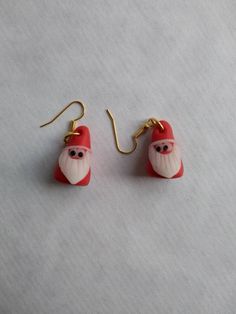 This funny  pair of earrings is perfect for Christmas!   The "santa"  is made of polymer clay and the earring hook is in  gold color. I can not guarantee that the hook is nickel free. The santas lenght is  2-2,5 cm.  The shipping cost to Sweden: 9kr Everywhere else : less than $2,5 For all my earings click: https://www.etsy.com/se-en/shop/minnalinn?ref=search_shop_redirect§ion_id=22586801 My products are made in a smoke and pet-free environment. Please feel free to send me a message if you have any questions. Market Ideas, Santa Claus Christmas, Christmas Earrings, Fun Earrings, Christmas Santa, Santa Claus, Sweden, Gold Color, Polymer Clay