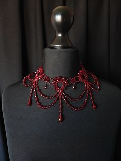 If you're looking for something very Unique and Unusual and would like to add an amazing look to your outfit then this Victorian Inspired neck accessory is for you. ❤Crystal beads, Japan beads. ❤Length: one size, fit any neck size. ❤Packaging: It is carefully shipped in a box with a velvet bag ❤This beauty can be made for you in any Crystal colors that fit your wedding or special outfit. Welcome to my shop  https://www.etsy.com/shop/JewelryFashionArt?ref=hdr_shop_menu Luxury Red Beaded Necklaces For Festive Occasions, Luxury Red Elegant Beaded Necklace, Halloween Costume Choker Necklace, Gothic Adjustable Necklace For Costumes, Fantasy Choker Necklace For Parties, Fantasy Halloween Choker Necklace, Fantasy Party Choker Necklace, Handmade Vampire Style Party Necklace, Red Choker Necklace For Halloween