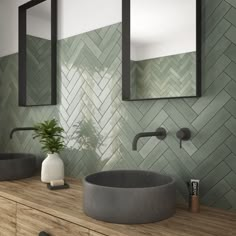 a bathroom with two sinks and mirrors on the wall next to a potted plant