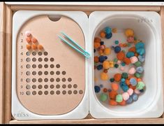 two trays filled with different types of beads