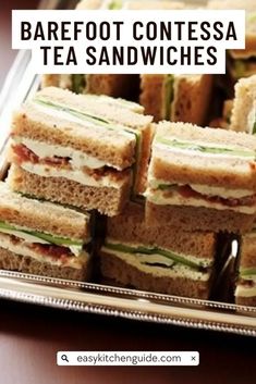 a tray full of sandwiches with the words barefoot contessa tea sandwiches on it