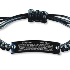 a black and white bracelet with a cross on it