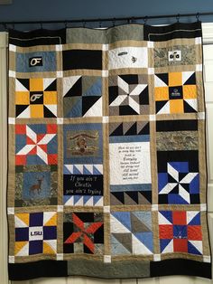 a quilt hanging from the side of a wall with words written on it and pictures