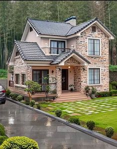 a car is parked in front of a house with stonework on the roof and windows