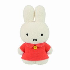 a white stuffed rabbit wearing a red shirt