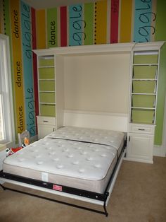 a bed that is sitting in the middle of a room