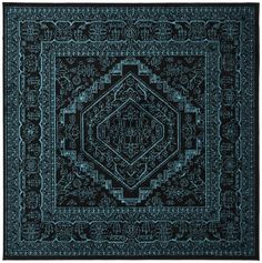 a black and blue rug with an intricate design