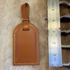 This Is A Gorgeous Louis Vuitton Luggage Tag. It Is In Almost Mint Condition, With Almost No Signs Of Wear. Color Is Amazing! Has The Plastic Inside Just An Amazing Condition Tag!!! Please Refer To The Photos For Details On The Condition Of This Item. Please Zoom In On Photos To See The Details And Ensure This Item Meets Your Expectations. Thanks! Louis Vuitton Luggage Tag, Louis Vuitton Luggage, Louis Vuitton Brown, Louis Vuitton Accessories, Luggage Tag, Luggage Tags, The Details, Mint Condition, Louis Vuitton