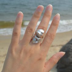 Wear this Fragment of a slipper seashell found at the beach, its' sleek and elegant form can be perfectly dressed up or dressed down. Wire Wrapped adjustable ring. Created from a Slipper Seashell turned into an adjustable ring Available in: Sterling Silver Ring Sterling Silver, Adjustable Ring, Dressed Down, Adjustable Rings, Sterling Ring, At The Beach, Wire Wrapped, Sea Shells, Sterling Silver Rings