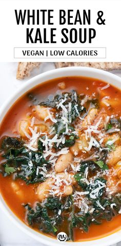 white bean and kale soup in a bowl with parmesan cheese on top