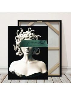 an art piece with a woman's head and snakes on it