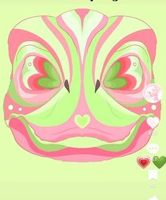 a green and pink mask with hearts on it