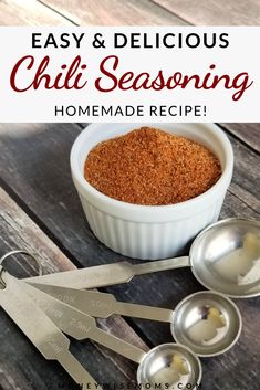 homemade chili seasoning recipe in a bowl with measuring spoons next to it on a wooden table