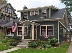 a house with an american flag on the front porch