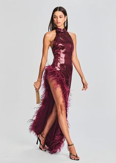 Elevate your glamour game with our Vixen Dress, a bold and breathtaking statement piece that exudes confidence and allure. With its halter neck, open back, and daring slit, this dress is designed to make you the star of any event. Shown here in Cabernet. 100% Polyester Made in China Model is 5'10" wearing size XS Style Sequin Long Dress, Wine Red Dress, Vestidos Halter, Backless Gown, Sequin Halter, Sleeveless Skirt, Woman Wine, Sequin Maxi, Sequin Maxi Dress