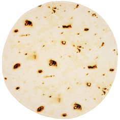 an uncooked tortilla on a white background with lots of brown spots