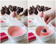 chocolate dipped marshmallows are being dipped into pink liquid in a white bowl