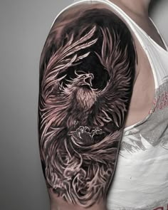 a man's arm with an eagle tattoo on it