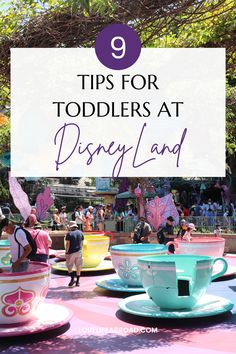 disneyland park with tea cups and saucers in the foreground text reads tips for toddlers at disney land