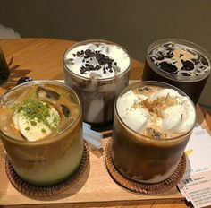 three different types of drinks on a wooden tray