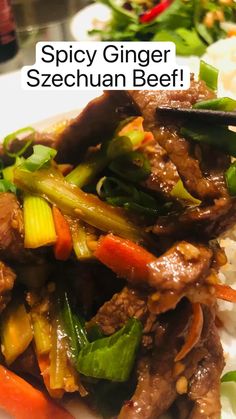 a close up of food on a plate with text overlay that reads spicy ginger sezechuan beef