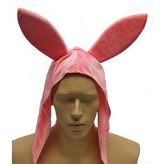 a male mannequin wearing a pink bunny ears headband and a pink towel