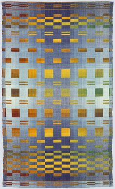 a blue, yellow and green rug with squares on the bottom in different colors that appear to be made from cloth