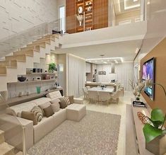 a living room filled with furniture and a flat screen tv