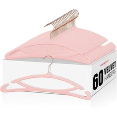 a pink hanger in a box on a white background