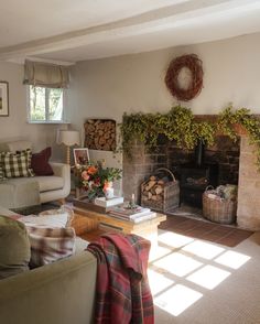 a living room filled with furniture and a fire place