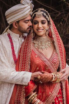 Bride with bold smokey eyes going in sync with her red Sabyasachi wedding look! Indian Bride Photography Poses, Indian Wedding Bride, Bridal Photography Poses, Indian Wedding Couple Photography