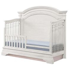 a white crib with blue sheets on the bottom and side rails, in front of a white background