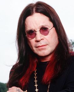 a man with long red hair wearing sunglasses