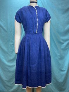 "1940s W:25 Vintage Indigo 40s dress nubby linen hand crochet lace short sleeve button up dress  Great 40s dress. Beautiful vintage shade of deep indigo blue in nubby linen. Bodice has a short sleeve and side overlap with hidden snaps. Edges are finished with hand crocheted off white lace. Side zipper. Pleated skirt. Photographed on fitting form size 2, check measurements.  MEASUREMENTS  Bust: 34\" Waist: 25\" Hips: free\" Bodice length: 16\" Skirt Length: 26\" with no hem available This is in g Hobby Activities, White Lace Short, Crochet Lace Shorts, 40s Dress, White Lace Shorts, Deep Indigo, Lace Side, Vintage Indigo, Lace Short