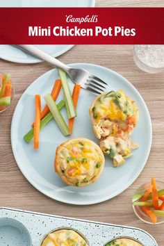 mini chicken pot pies on a plate with carrots and celery sticks