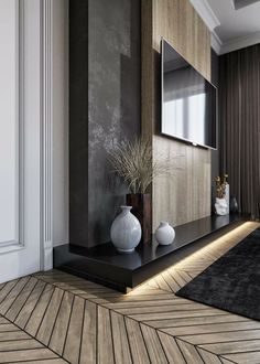 a modern living room with wood paneling and white vases