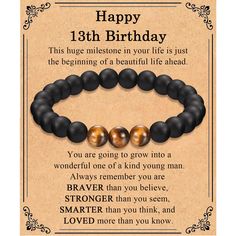 a happy 13th birthday card with two black and gold beads