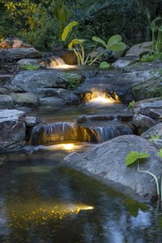 there are many lights on the rocks in this stream