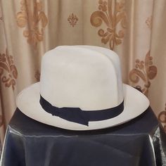 A Rare Find! Classic Handmade Finely Woven Straw Panana Hat From 1920's. Was In Storage All These Years And In Great Condition. Measures 22" On Inner Leather Band. Black Fabric Ribbon On Outside. Needs A New Appreciate Home, Enjoy! Formal White Fedora Straw Hat, Classic White Toquilla Straw Hat Bands, White Adjustable Panama Hat For Formal Occasions, Classic White Flat Brim Panama Hat, Classic White Panama Hat With Curved Brim, Classic White Panama Hat With Flat Brim, White Brimmed Fedora For Kentucky Derby, White Fitted Fedora Straw Hat, Classic White Wide Brim Fedora